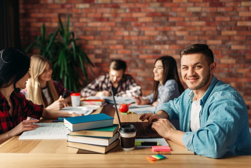group-university-students-sitting-table_266732-1111