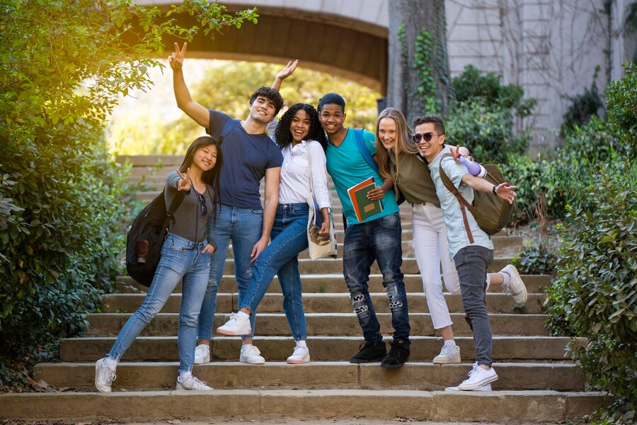 group-young-university-multiracial-students-waving-camera-some-stairs_533849-414
