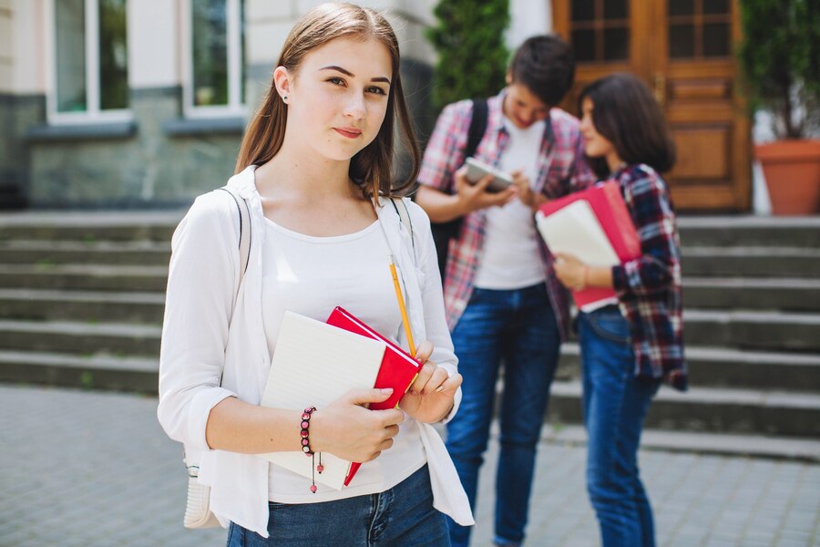 young-student-posing-near-university_23-2147656112