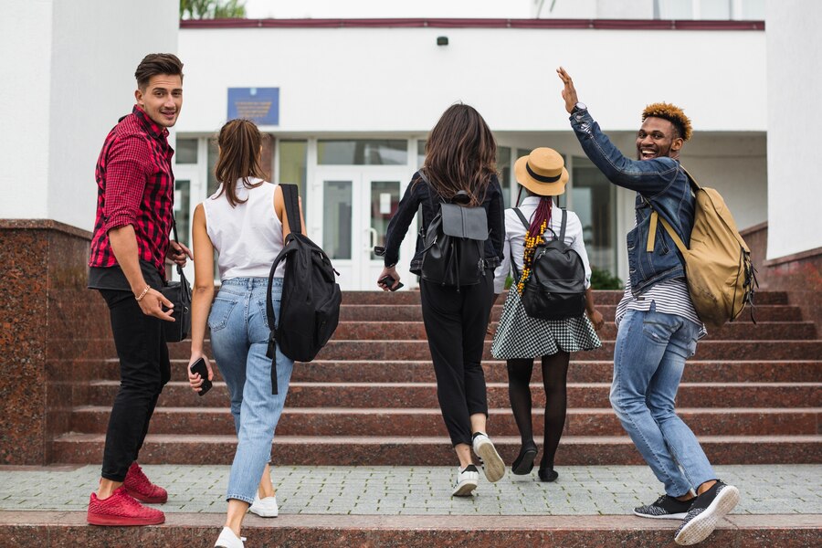 young-students-walking-up-stairs_23-2147663337